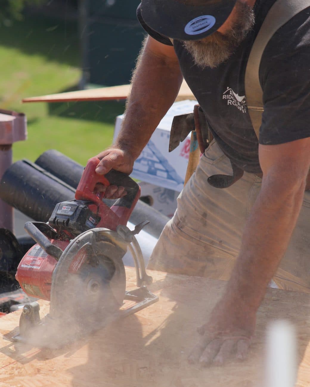 Mike Zomerfeld of Ridge Runner Roofing cutting roof sheathing on a job