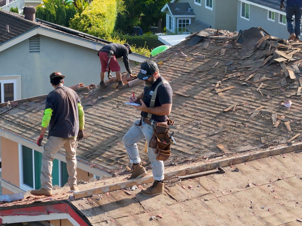 Ridge Runner Roofing crew working a roof tearoff in a coastal Southern California neighborhood